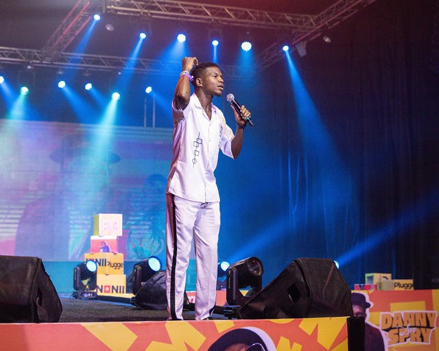 A performer holding the room on the comedy stage