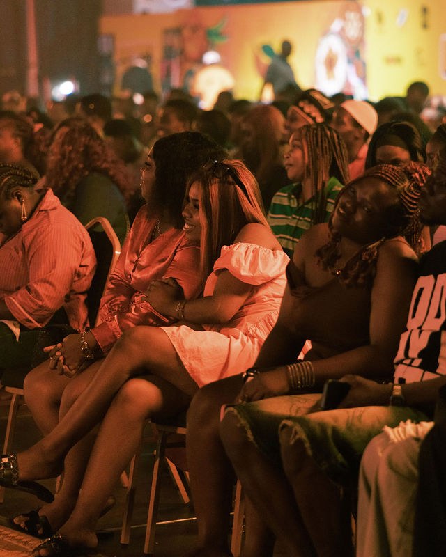 Guests smiling and enjoying the show